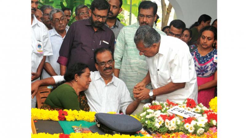 Chief Minister Pinarayi Vijayan consoles V.P. Sahadevan and Jayashree, parents of Flight Lieutenant S. Achu Dev who was killed in Sukhoi-30 crash in Assam, after he paid his respects at their home at Pongumoodu in Thiruvananthapuram on Friday. (Photo: A.V. MUZAFAR)