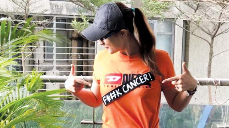 Tahira posed wearing a t-shirt with the words f # # k cancer written on it and captioned the picture saying
