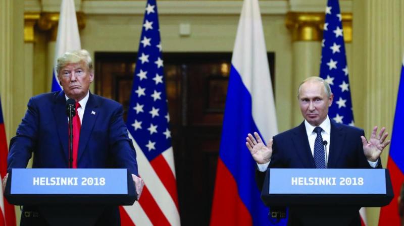 US President Donald Trump and Russian President Vladimir Putin talk to the media after their meeting in the Presidential Palace in Helsinki. (Photo: AP)