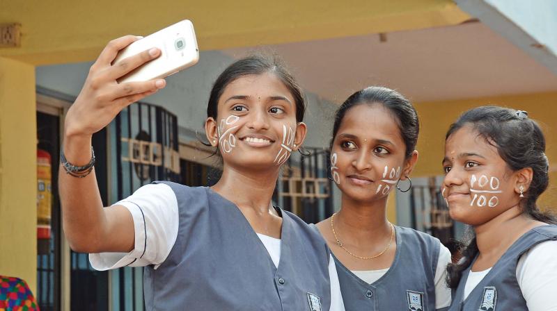Students of Everwin school, Kolathur, celebrate their results by clicking selfies. (Photo: DC)