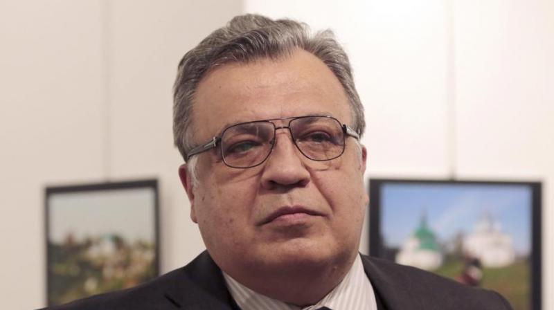 Andrei Karlov, the Russian Ambassador to Turkey, speaks at a photo exhibition in Ankara on Dec 19 moments before a gunman opened fire on him. (Photo: AP)