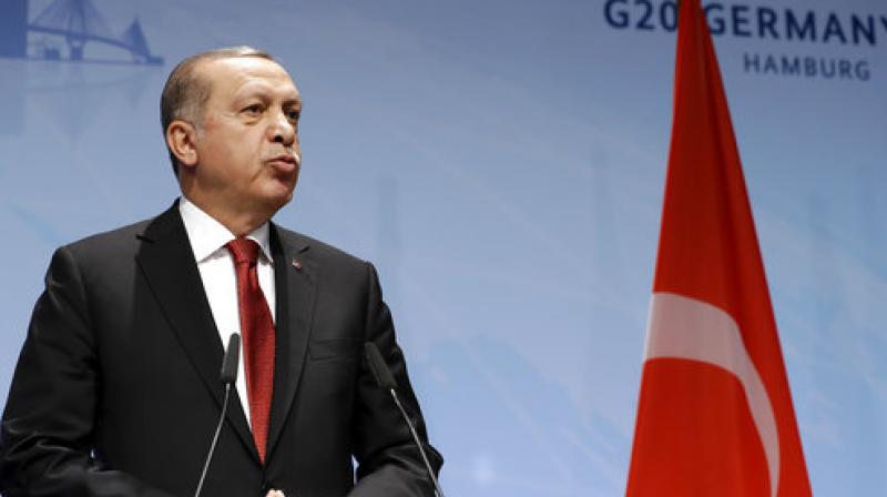 He said former French president Francois Hollande had promised him that Turkey would be classed as a developing and not an industrialised economy -- meaning Ankara would receive money from a global climate fund rather than have to pay into it. (Photo: AP)