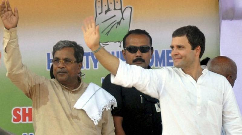 The Congress said that a mega event will be organised in the state capital on Indira Gandhis birthday on November 19. In picture: File photo of Congress Vice-President Rahul Gandhi and Karnataka Chief Minister Siddaramaiah. (Photo: PTI)