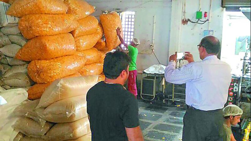 Vigilance CI Venkateswara Rao inspects stock at a food manufacturing unit in Vijayawada on Thursday. (Photo: DC)