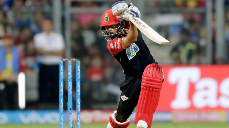 Virat Kohlis batting efforts went in vain as Royal Challengers Bangalore (RCB) were outclassed by Rohit Sharma-led Mumbai Indians (MI) in the 14th match of the ongoing Indian Premier League (IPL) at Wankhede Stadium on Tuesday. (Photo: AP)