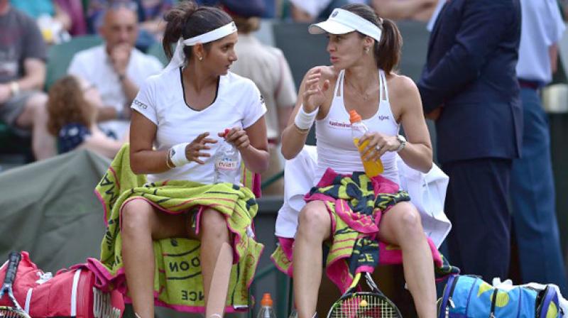 Sania Mirza and Martin Hingis will face each other with different partners  (Photo: Facebook/Wimbledon)