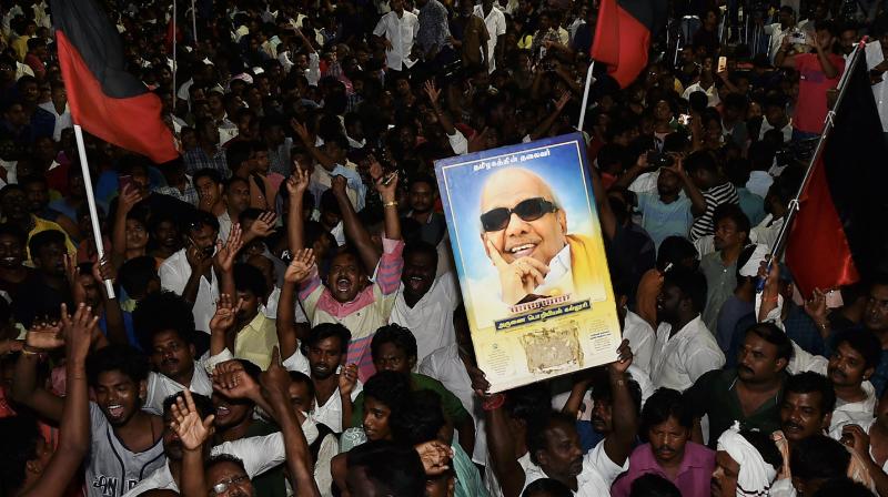 DMK supporters gather outside the hospital where M Karunanidhi is being treated, in Chennai. (Photo: PTI)