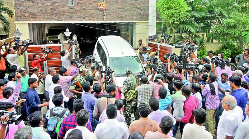 Crowds gather outside the residence of Tamil Nadu Chief Secretary P. Rama Mohana Rao, who had come under I-T scanner in Chennai on Wednesday. (Photo: DC)