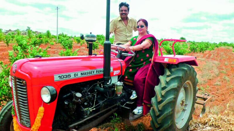 Actor Naresh with his mother Vijaya Nirmala on a tractor in their farm on the outskirts of Hyderabad