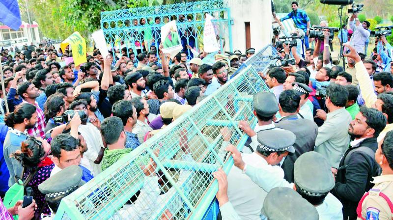 Police tries to prevent students from entering the campus at the main gate of the University of Hyderabad on Tuesday. (Photo: P. Surendra)