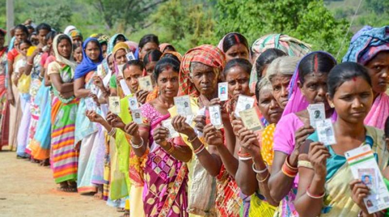 Voters queue outside a polling booth during a recently concluded bypolls. (Photo: PTI)