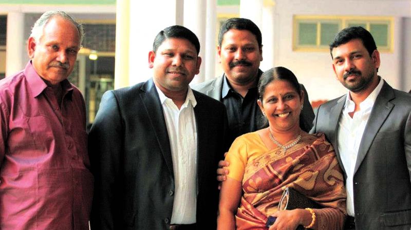 Asha with husband Ashok Marshal and sons.