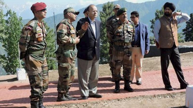 Defence Minister Arun Jaitley with GOC of Baramulla based Division, Maj Gen RP Kalita during a visit to the forward areas of Rampur Sector of North Kashmir on Friday. (Photo: PTI)