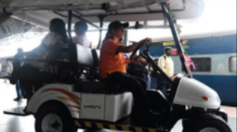 A battery-run buggy being driven at railway station.