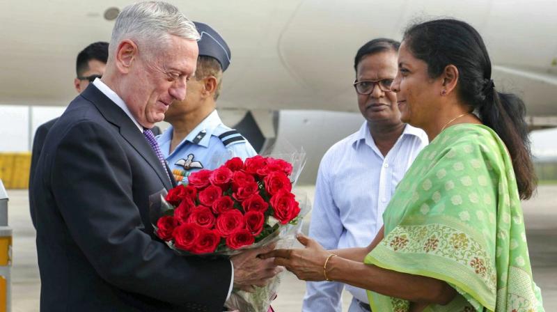 Defence Minister Nirmala Sitharaman presents bouquet to US Secretary of Defence James Mattis on his arrival in Delhi, to attend Indias first ever 2+2 Dialogue between the two nations. (Photo: PTI)