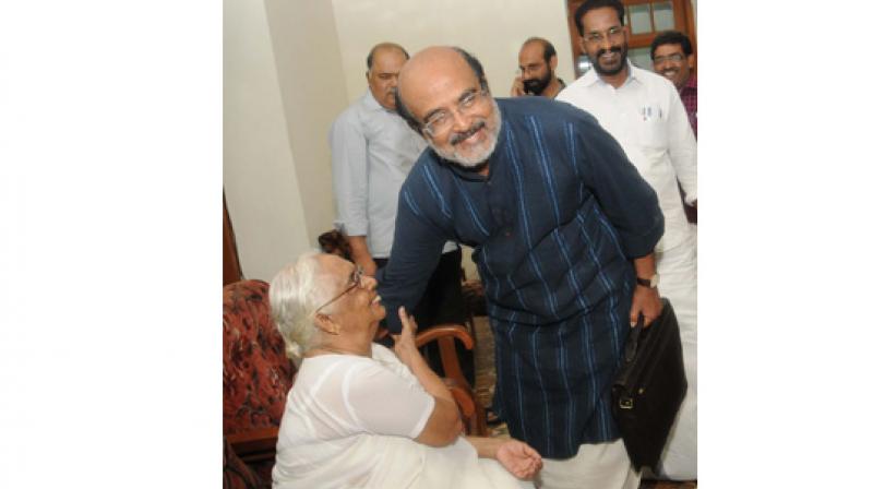 Finance Minister T. M. Thomas Isaac seeks blessings of mother Saramma Mathew before proceeding to the Legislative Assembly on Friday.  (Photo: A.V. MUZAFAR)