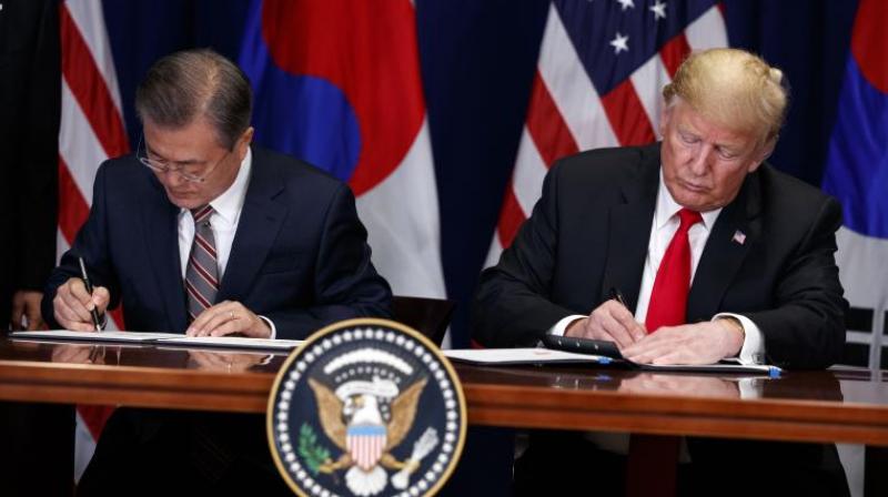 President Donald Trump and South Korean President Moon Jae-In participate in a signing ceremony for the United States-Korea Free Trade Agreement at the Lotte New York Palace hotel during the United Nations General Assembly, Monday, September 24, 2018, in New York. (Photo: AP)