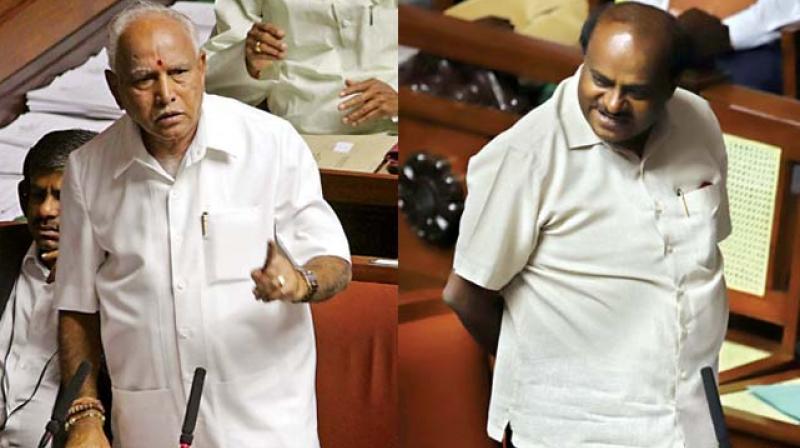 State BJP chief B.S. Yeddyurappa and Chief Minister H.D. Kumaraswamy speak during the Assembly session in Bengaluru on Monday (Image DC)