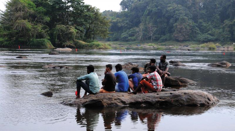 Local residents gathered at Mahagony Thottam near Periyar river after a drowning incident on Wednesday. (Photo: ARUNCHANDRA BOSE)