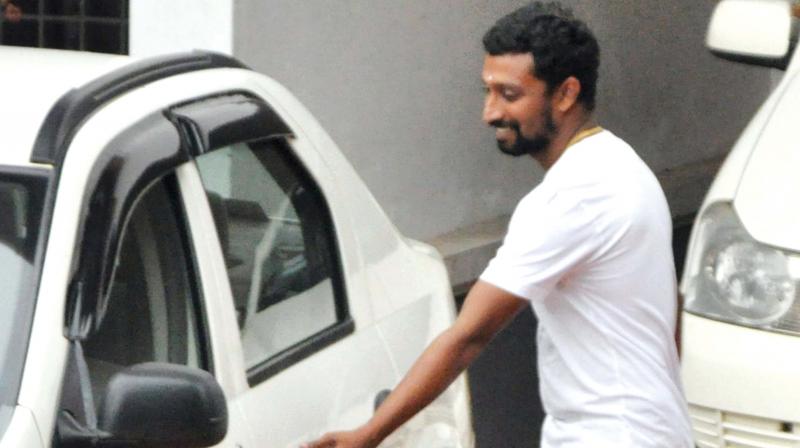 Sunil Raj aka Appunni comes out of Aluva Police Club on Monday. (Photo: DC)