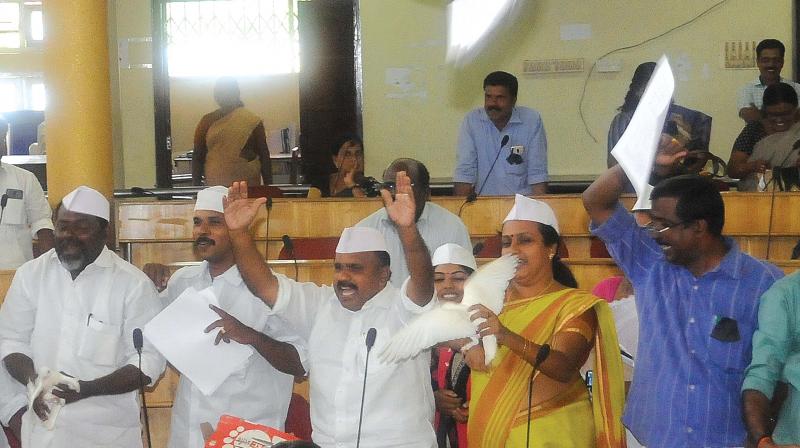 UDF councillor V.R. Sini releases a dove inside the council hall  (Photo: DC)