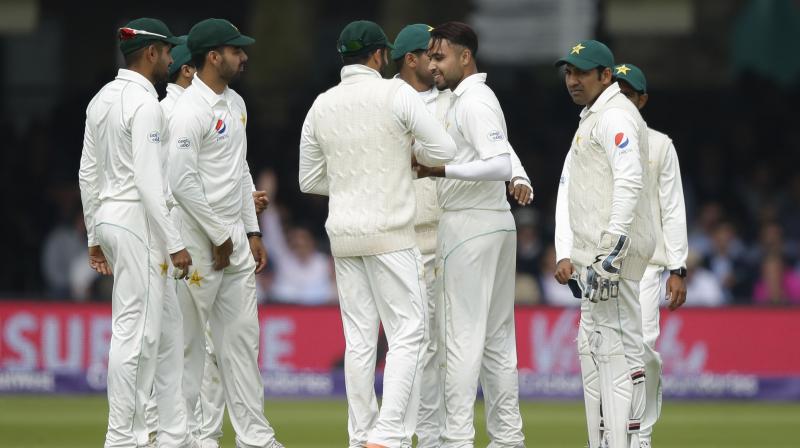 Although there is no suggestion of impropriety, that Pakistans Asad Shafiq and Babar Azam were seen wearing what appeared to be smart watches concerned the ICC. (Photo: AP)