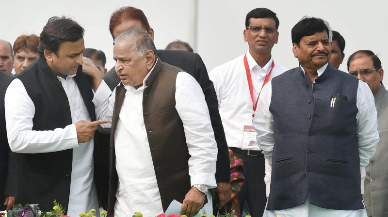SP supremo Mulayam Singh Yadav, UP CM Akhilesh Yadav and SPs UP chief Shivpal Singh Yadav during a function in Lucknow. (Photo: PTI)