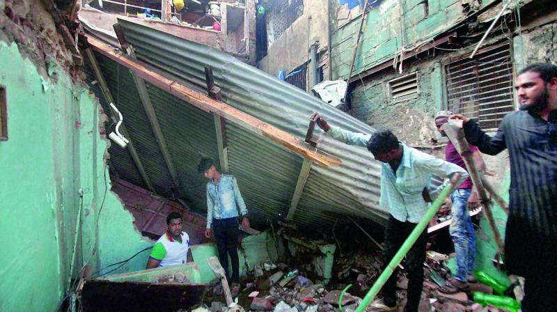 A five-storey structure collapsed in Behrampada at Bandra in Mumbai on Thursday. (Photo: PTI)