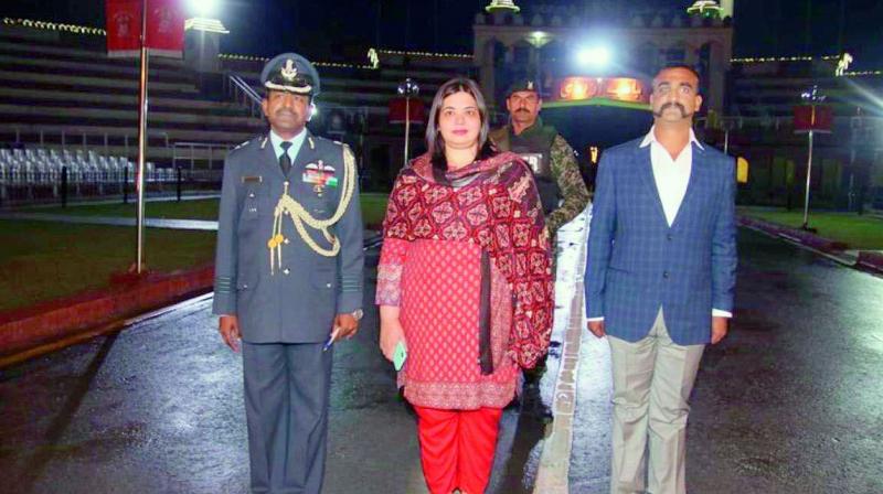 Wing Commander Abhinandan, an Indian Air Force official with Dr Fareha Bugti, director (India) at the Pakistan foreign office, before crossing over the Wagah Border.  (Via Web)