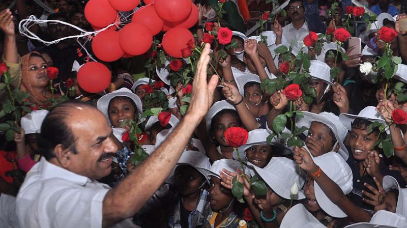 Children welcome CPM State secretary Kodiyeri Balakrishnan with red roses during the last day of Left Democratic Fronts Kerala Samrakshana yatra in Kochi on Friday.  (SUNOJ NINAN MATHEW)