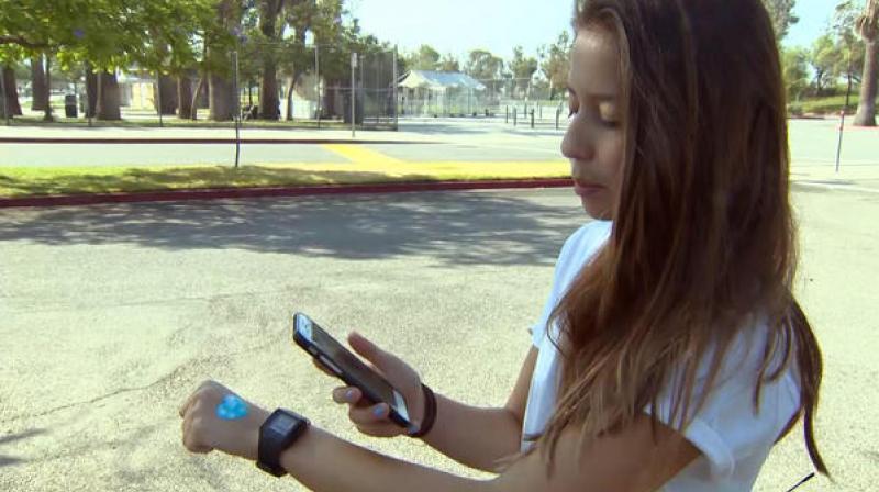 The wearable patch helps you monitor the potentially dangerous effects on your health that the harmful ultraviolet rays can have. (photo: CBS News)