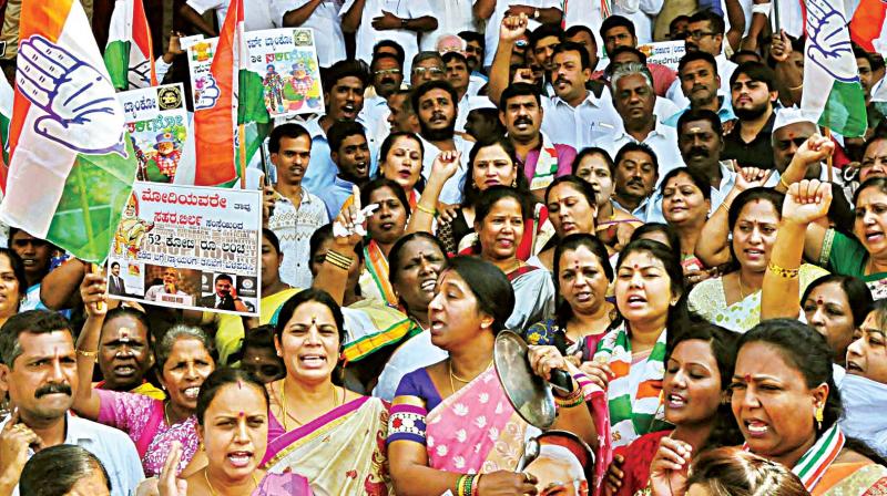 Congress party workers protest against demonetisation at Town Hall in Bengaluru on Tuesday