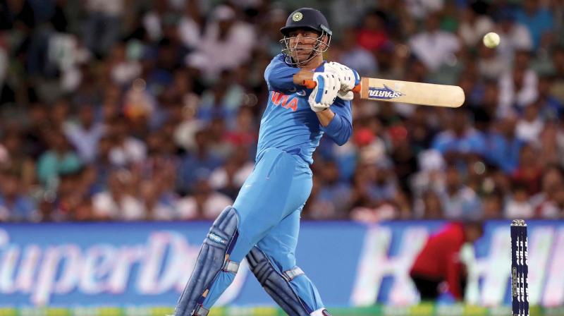 M.S Dhoni plays a shot against Australia in Adelaide on Tuesday	(Photo: AP)