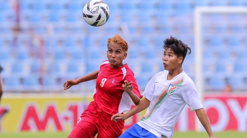 The match had a cagey beginning, as both the sides looked to find their feet. Indias first chance came through captain Jabamani Tudu, who rose above the Nepal defenders to meet a cross from Manisha, but her effort was blocked by the defenders. (Photo: Twitter / Indian Football Team)