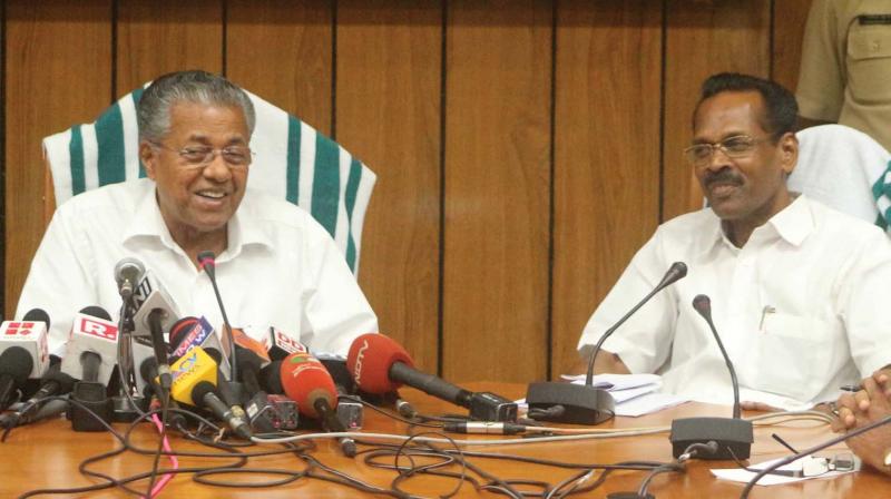 Chief Minister Pinarayi Vijayan announces LDF governments new liquor policy after the cabinet meeting in Thiruvananthapuram on Thursday. Excise Minister T.P. Ramakrishnan is also seen. (Photo: DC)