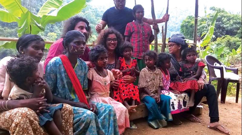 Volunteers with tribal children during the life skill camp organised by district child protection unit at Attathod in Pathanamthitta.	(Photo: FILE)