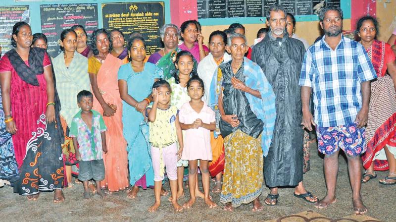 Fisher folk evacuated to safety from the coastal villages along North Chennai Coast on Monday.