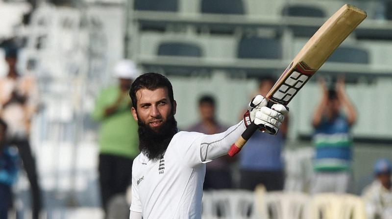 Englands Moeen Ali raises his bat after scoring century during the first day of the fifth cricket test match against India at MAC Stadium in Chennai on Friday. (Photo: AP)