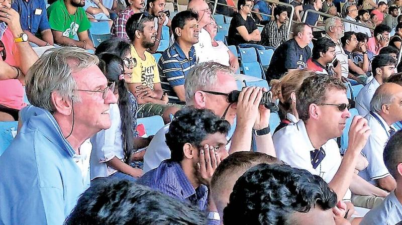 John Lever (left) is watching the day one action from the terrace stands at Chepauk.