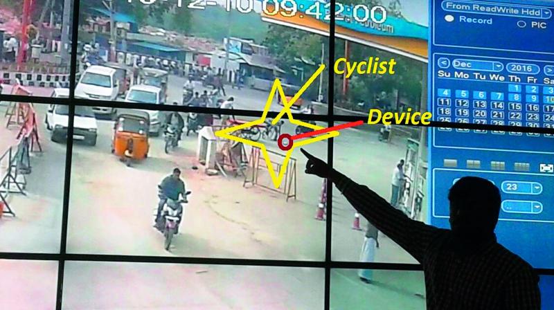 Video footage of cyclist picking up the biometric device in Tirupati.