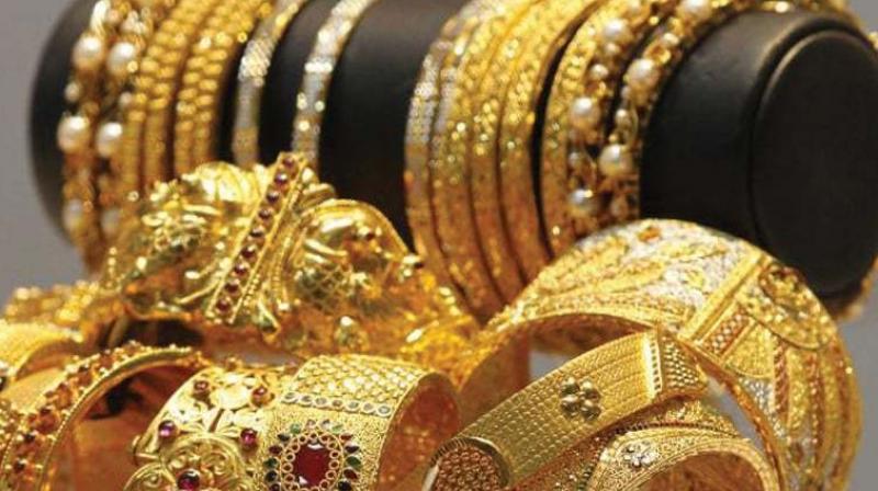 Gold prices in global market fell as much as 0.96 per cent to USD 1,291.50 an ounce in Singapore today.