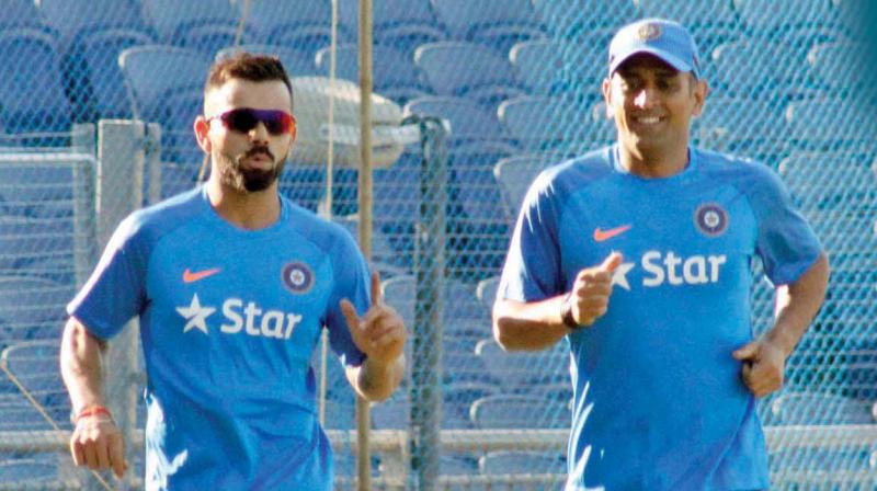 Virat and Dhoni during a training session