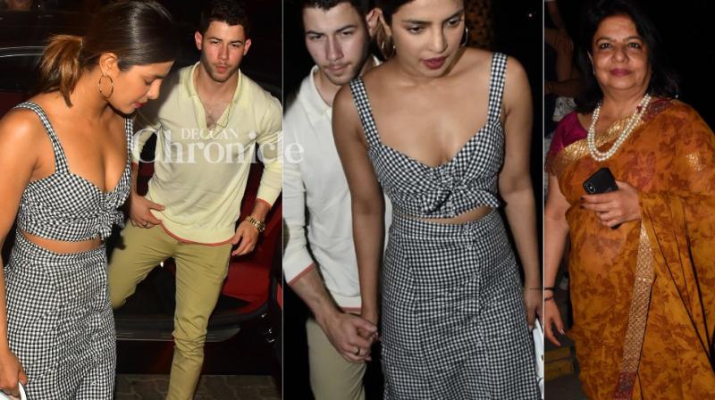 Priyanka Chopra with rumoured boyfriend Nick Jonas and mother Madhu Chopra outside a restauarant at Bandra Kurla Complex.