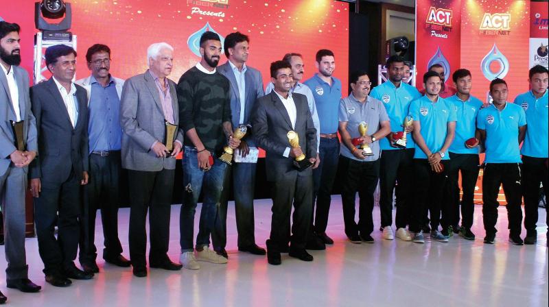 The awardees strike a pose with their spoils on Sunday. (Photo: DC)