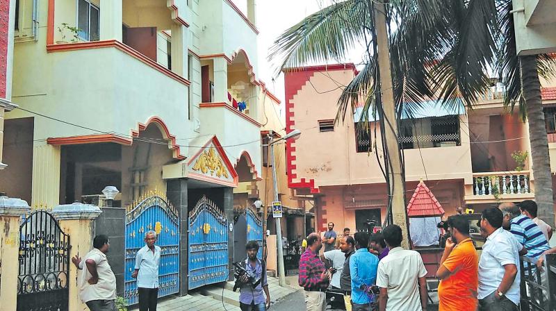 Residents gathered in front of the apartment where the actress was found dead at Saligramam on Sunday. (Photo: DC)