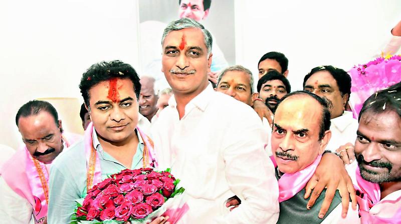 K.T Rama Rao with T. Harish Rao after he assumed charge as TRS working president at Telangana Bhavan (Photo: DC)