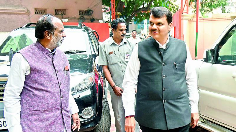Maharashtra Chief Minister Devendra Fadnavis arrives at BJP state headquarters on Monday to announce a protest against Congress president Rahul Gandhi for allegedly spreading lies in connection with the Rafale scam.(Photo: Gandhi)