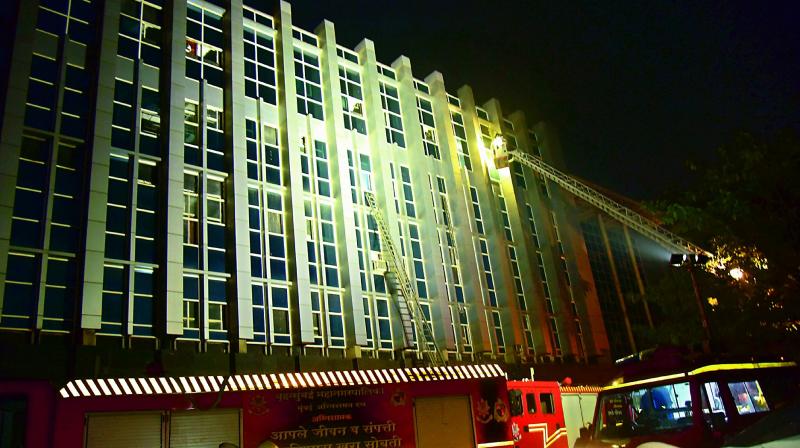 Firemen rescue people from a ESIC Kamgar Hospital in MIDC Marol, Andheri after it caught fire on Monday. (Photo: Mrugesh Bandiwadekar)