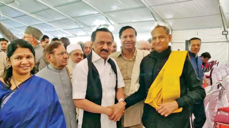 DMK president M. K. Stalin, accompanied by MP sister Kanimozhi greets Ashok Gehlot who was sworn in as Chief Minister of Rajasthan in Jaipur on Monday. (Photo: DC)