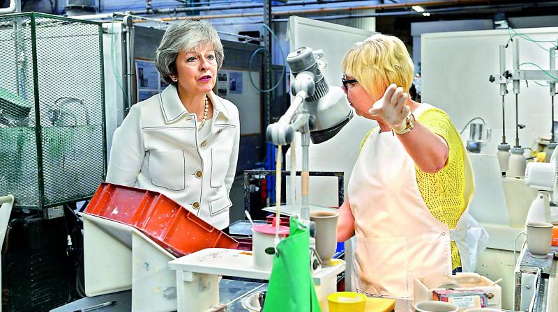 Britains Prime Minister Theresa May visits the Portmeiron factory in Stoke-on-Trent on Monday. (Photo: AFP)